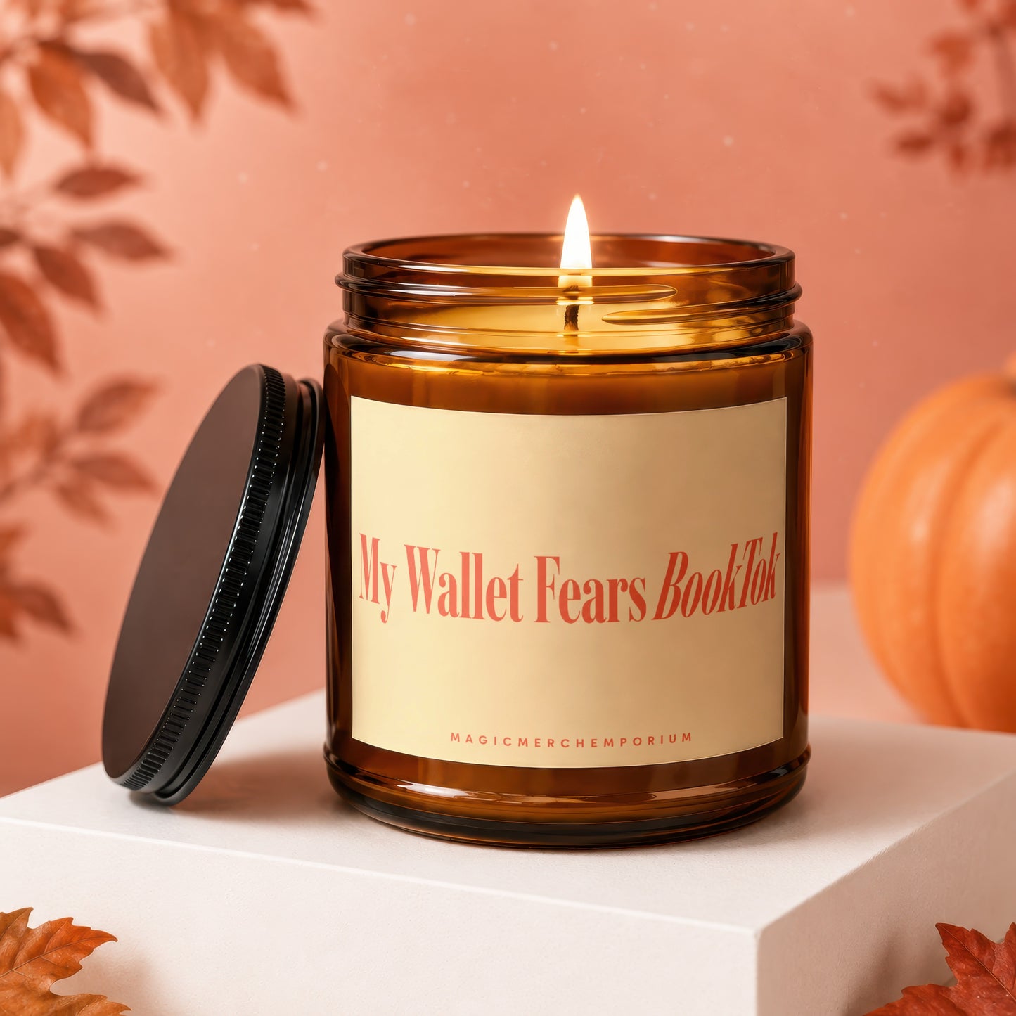 Amber candle with lit flame and "My Wallet Fears BookTok" text on label.