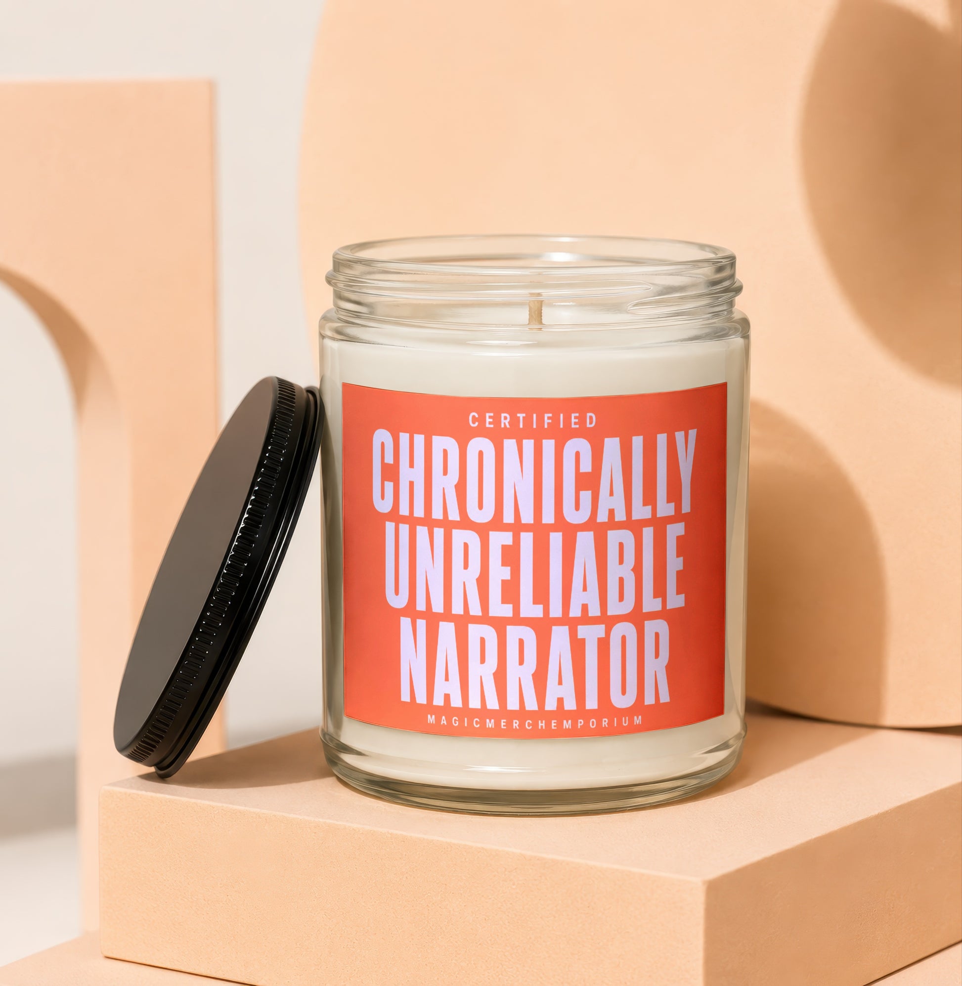 Candle with orange label reading "Certified Chronically Unreliable Narrator"
