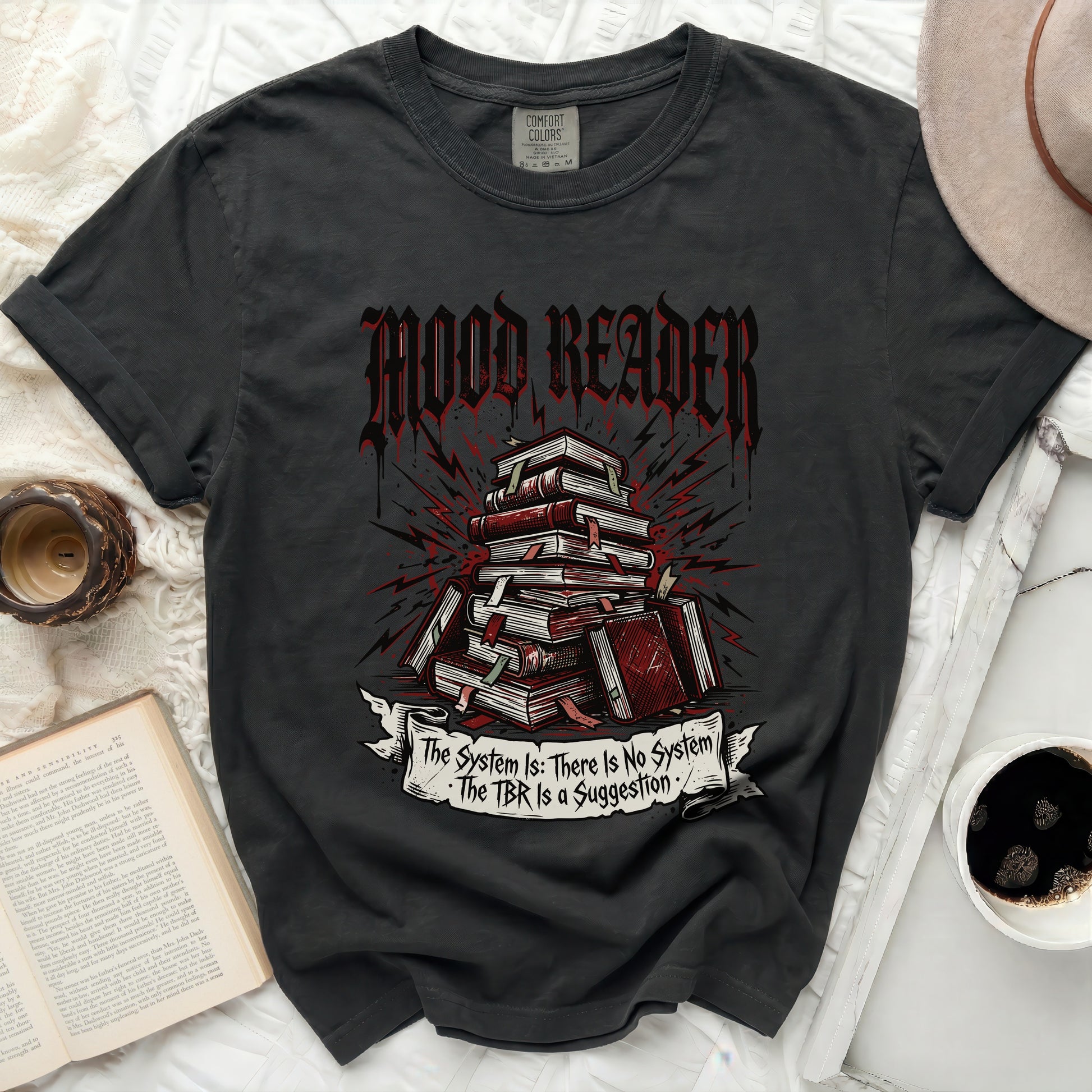 Black t-shirt with "Mood Reader" and stack of books graphic.