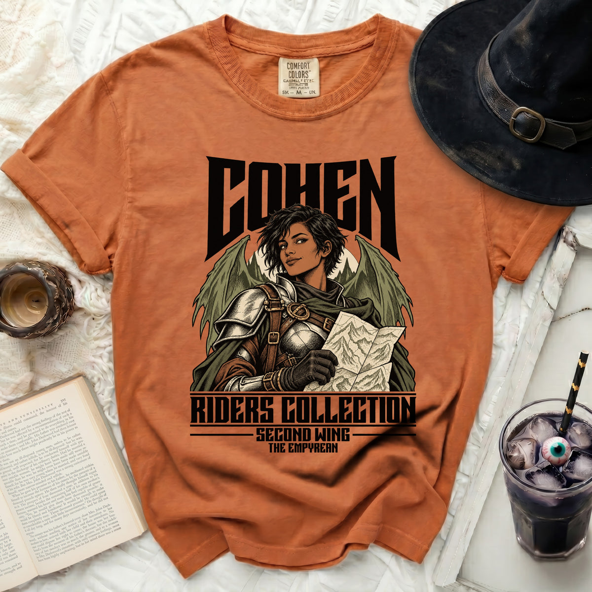 Orange t-shirt with "COHEN RIDERS COLLECTION SECOND WING THE EMPYREAN" graphic.