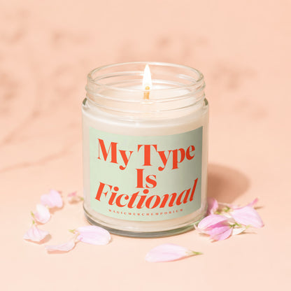 Candle with text "My Type Is Fictional" surrounded by pink petals.