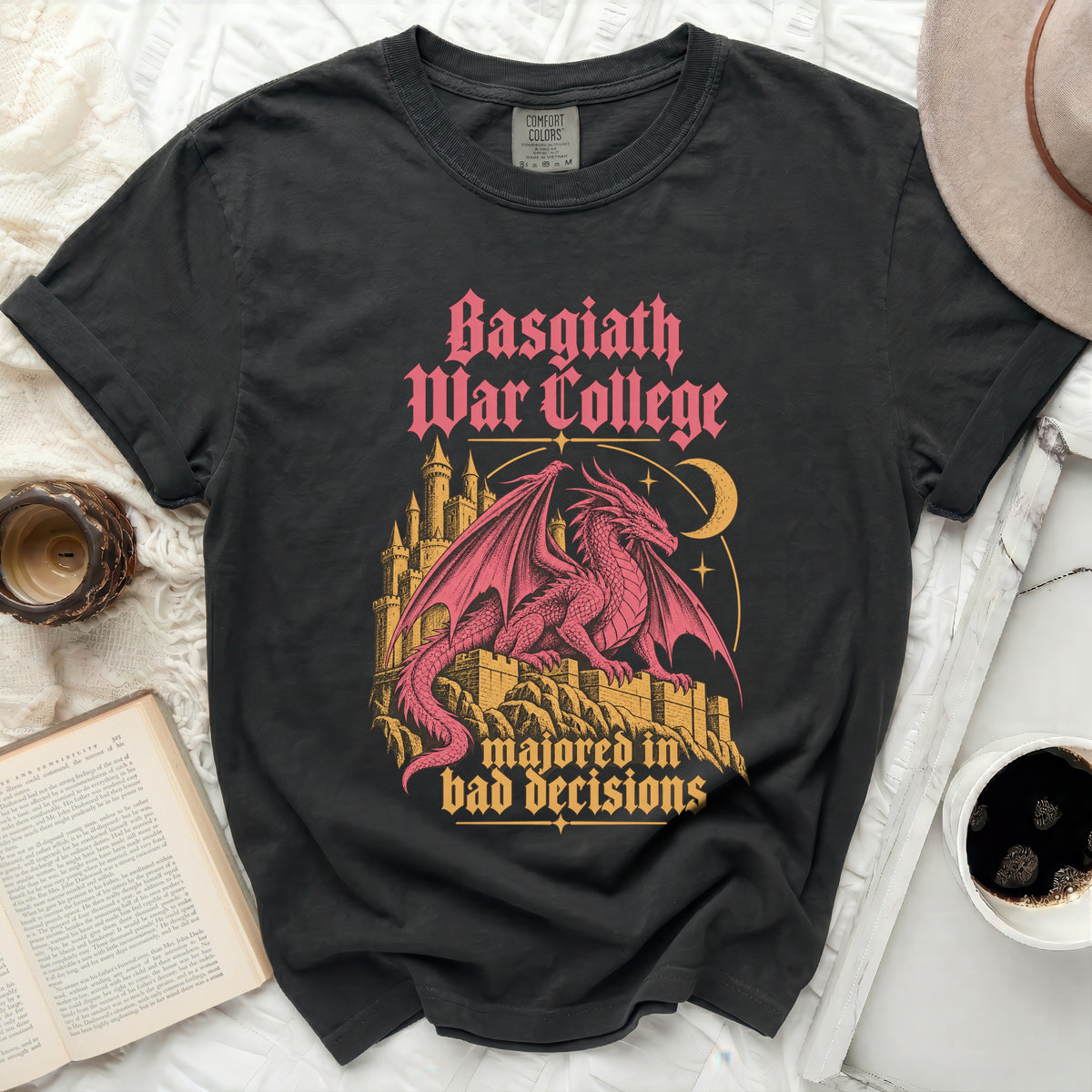 Black t-shirt with pink dragon, castle, moon, and text "Basgiath War College majored in bad decisions".