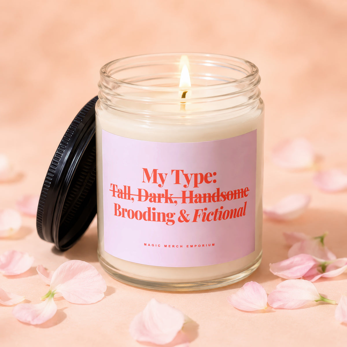 Lit candle with a pink label reading "My Type: Tall, Dark, Handsome, Brooding & Fictional."