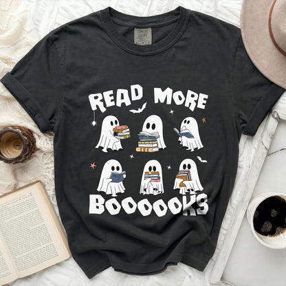 Black t-shirt with ghosts reading books holding stacks of books.