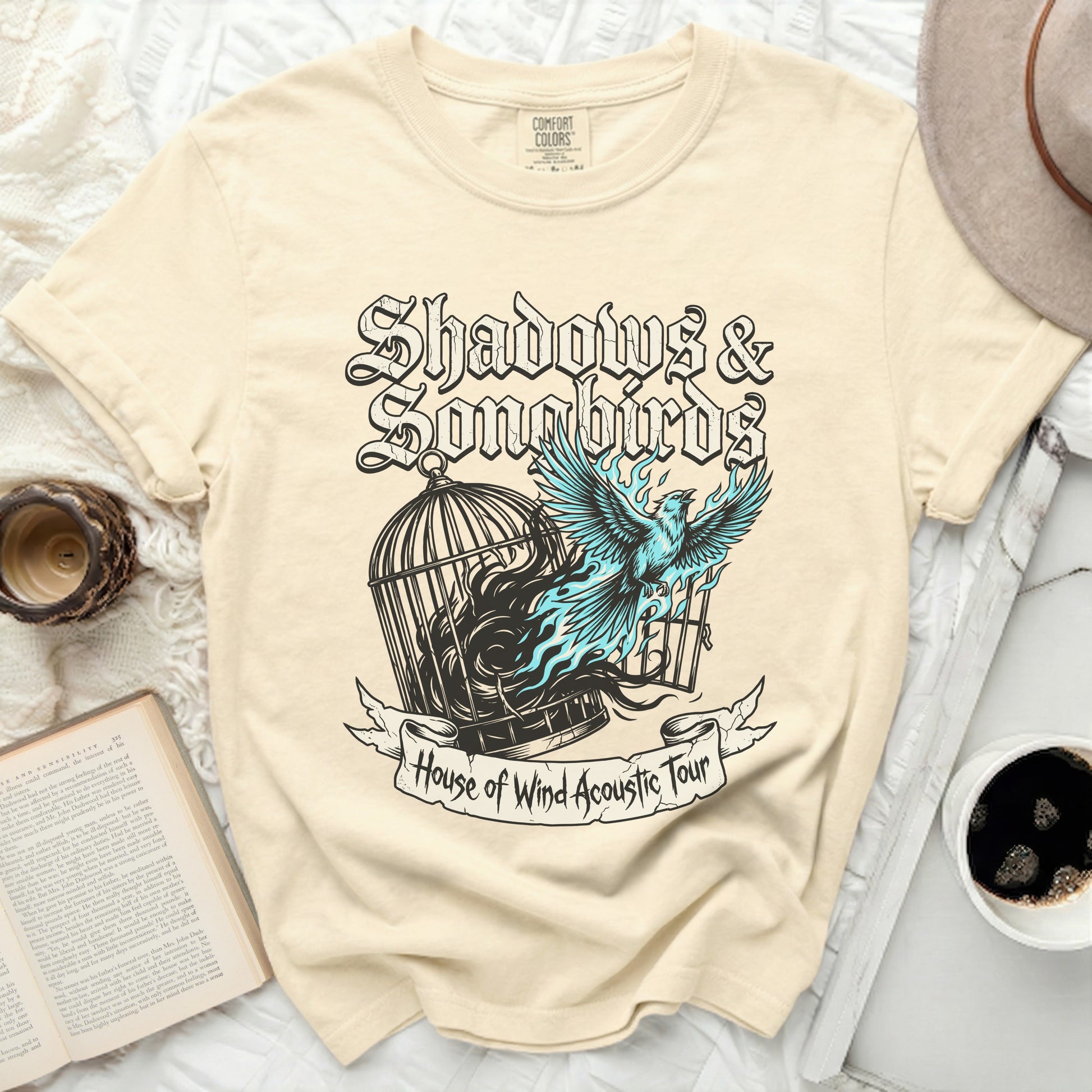 Cream t-shirt with "Shadows & Songbirds" and "House of Wind Acoustic Tour" graphics.