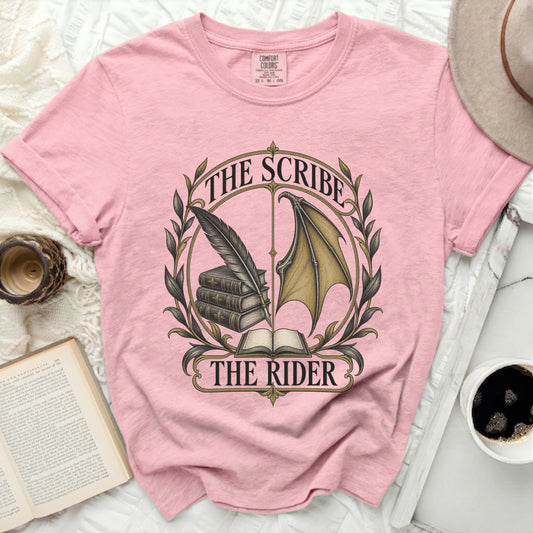 Pink t-shirt with "The Scribe, The Rider" and quill, books, and wing graphic.