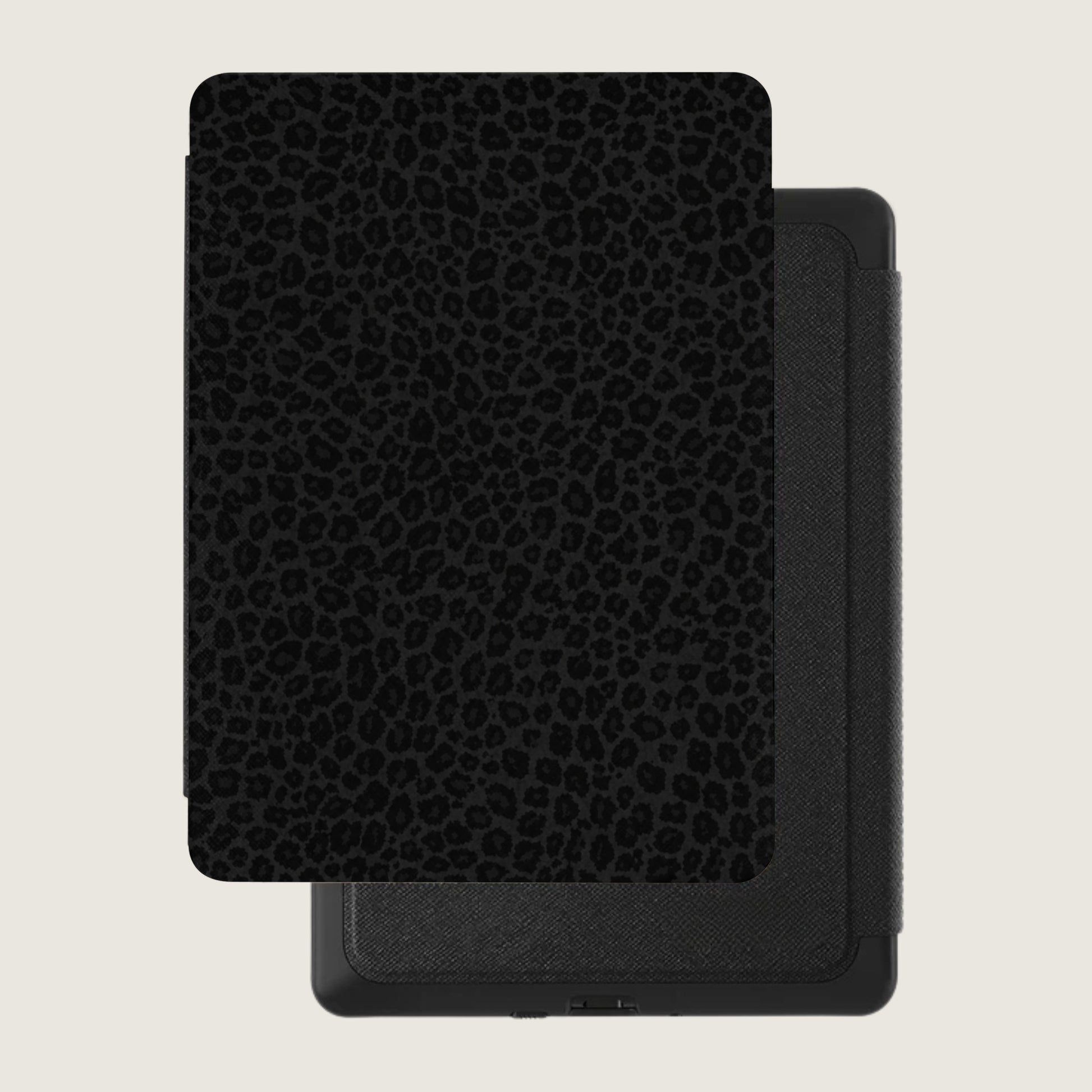 Black leopard print e-reader case with a textured grey spine.