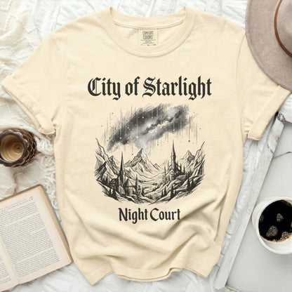 Cream t-shirt with "City of Starlight Night Court" and celestial landscape graphic.