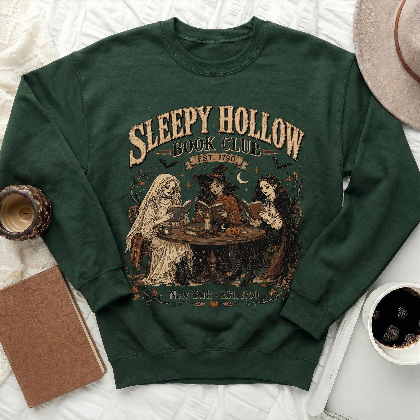 Green sweatshirt with "Sleepy Hollow Book Club Est. 1790" text and supernatural characters.