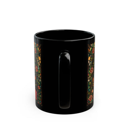 Black mug with art nouveau floral design and red lettering.