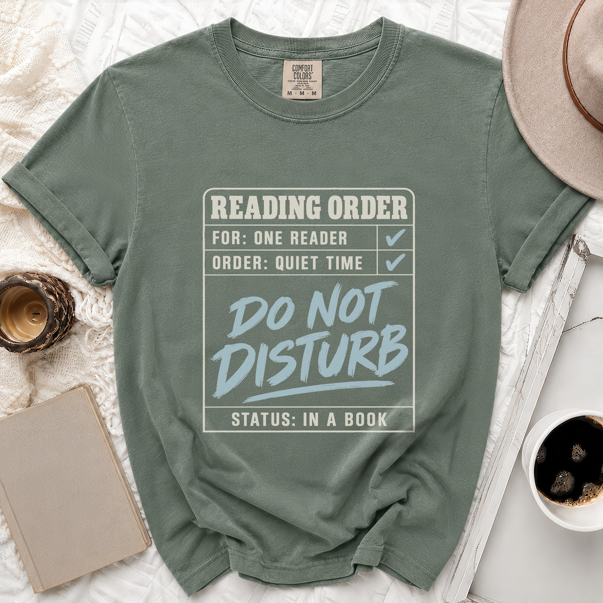 Green t-shirt with "Reading Order: For: One Reader, Order: Quiet Time, Do Not Disturb, Status: In A Book" graphic.