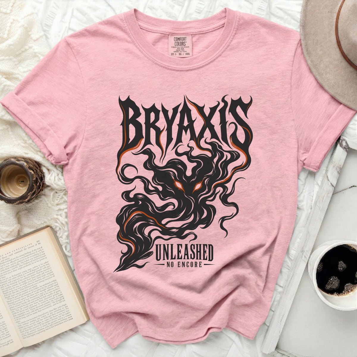 Pink t-shirt with "BRYAXIS UNLEASHED NO ENCORE" graphic and a dark, fiery creature.