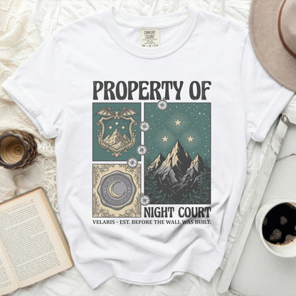 White t-shirt with "PROPERTY OF NIGHT COURT" graphic and moon, stars, and mountains design.