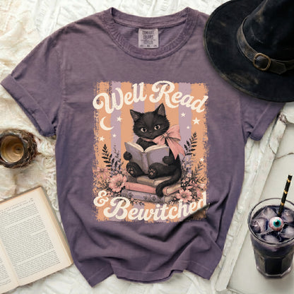Black cat reading book with "Well Read & Bewitched" text.