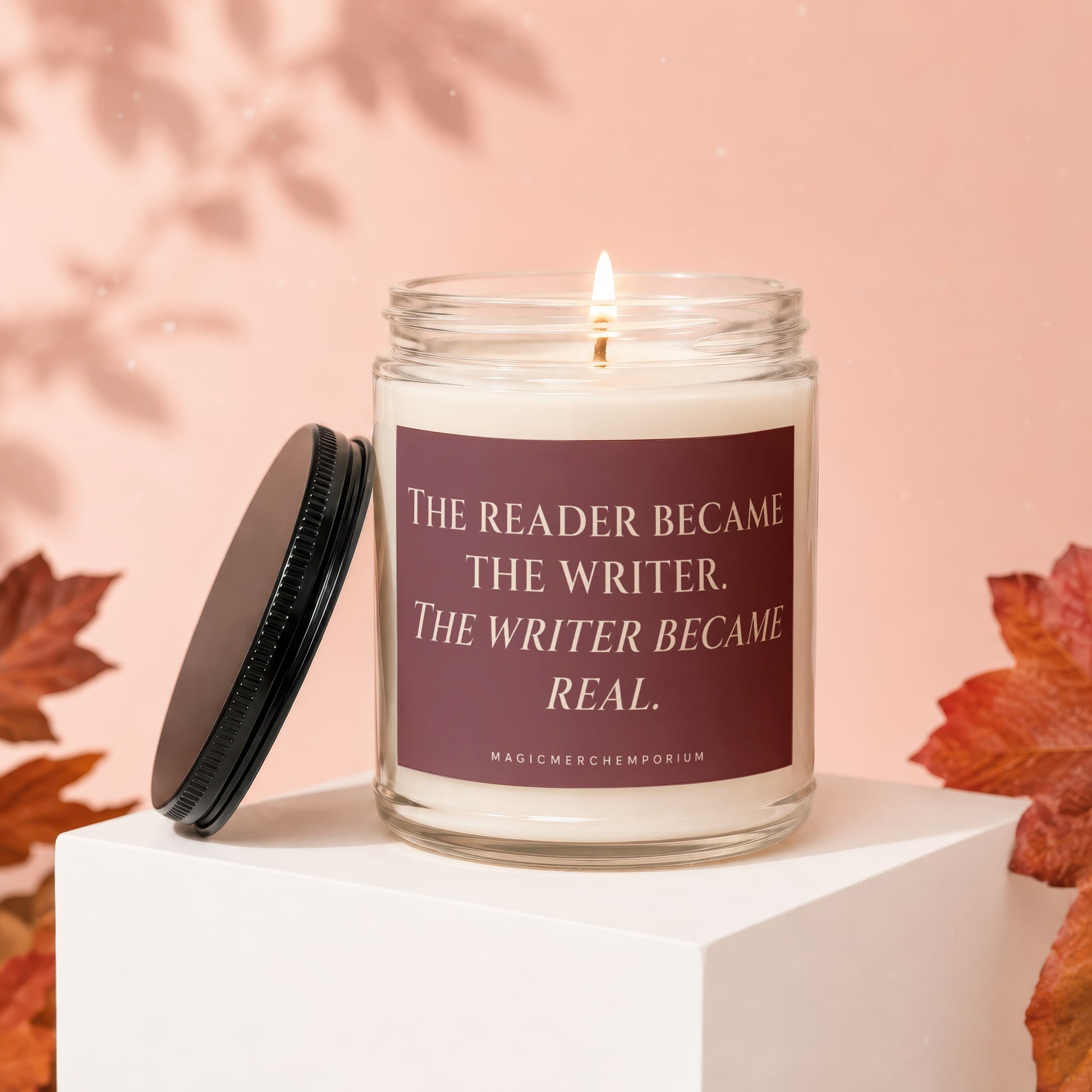 Candle with the quote "The reader became the writer. The writer became real."