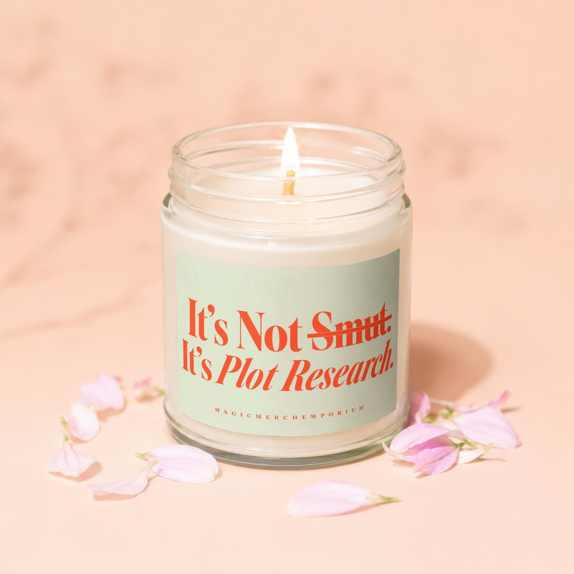 Lit candle in glass jar with "It's Not Smut. It's Plot Research" text.