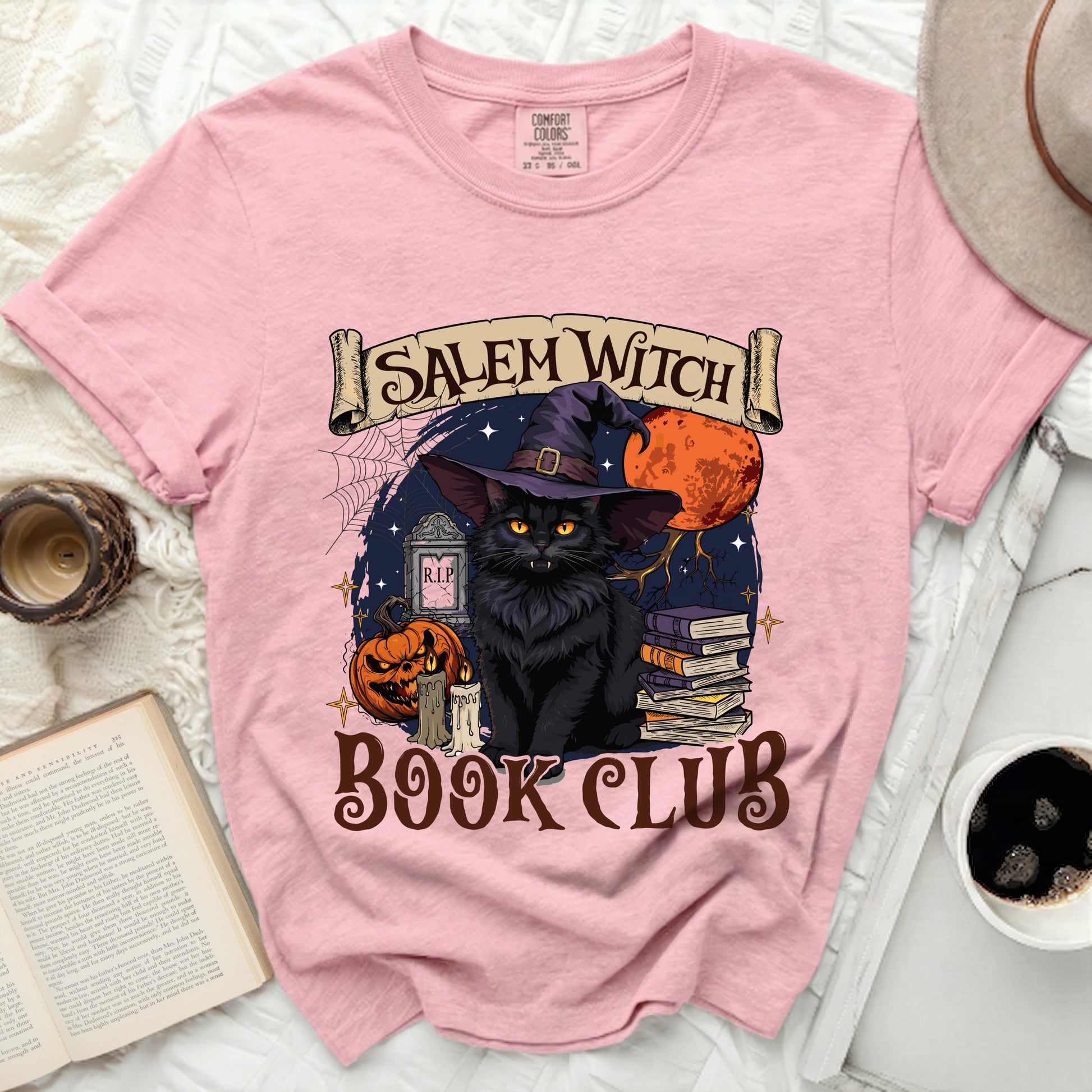 Pink t-shirt with a Salem Witch Book Club graphic featuring a black cat.