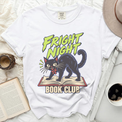 White t-shirt with black cat on an open book and "FRIGHT NIGHT BOOK CLUB" text.