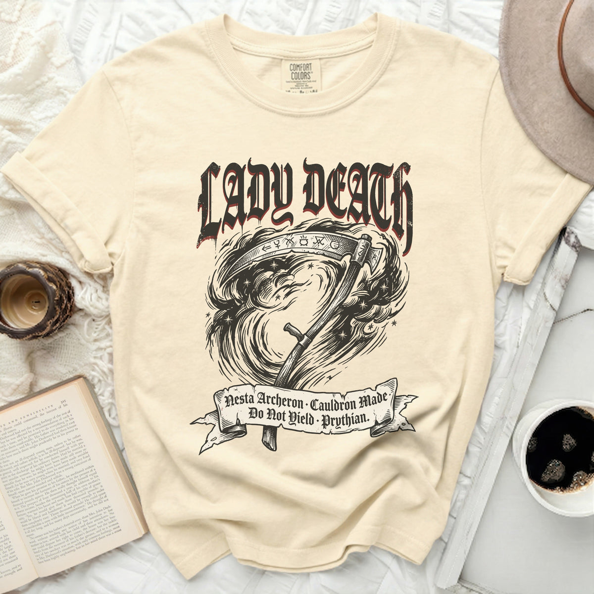 Cream t-shirt with "Lady Death" and scythe graphic, text "Nesta Archeron Cauldron Made Do Not Yield Prythian".