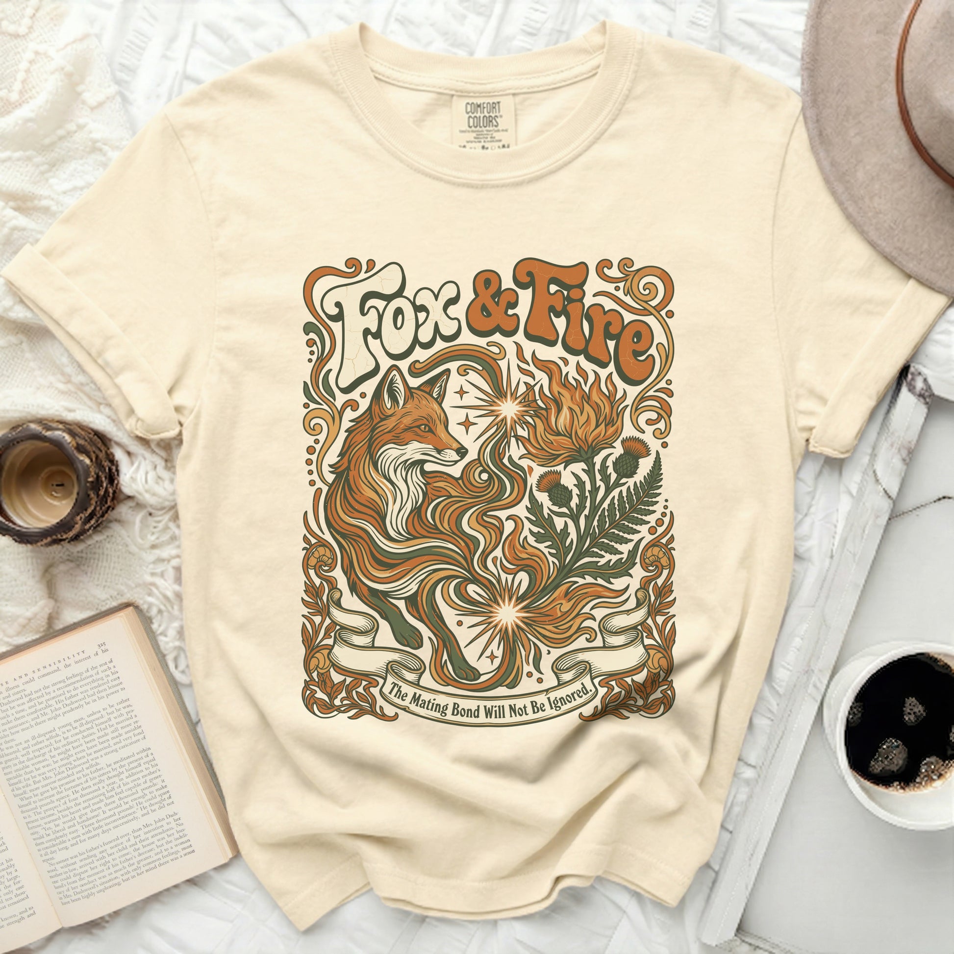 Cream t-shirt with "Fox & Fire" graphic and text "The Mating Bond Will Not Be Ignored."