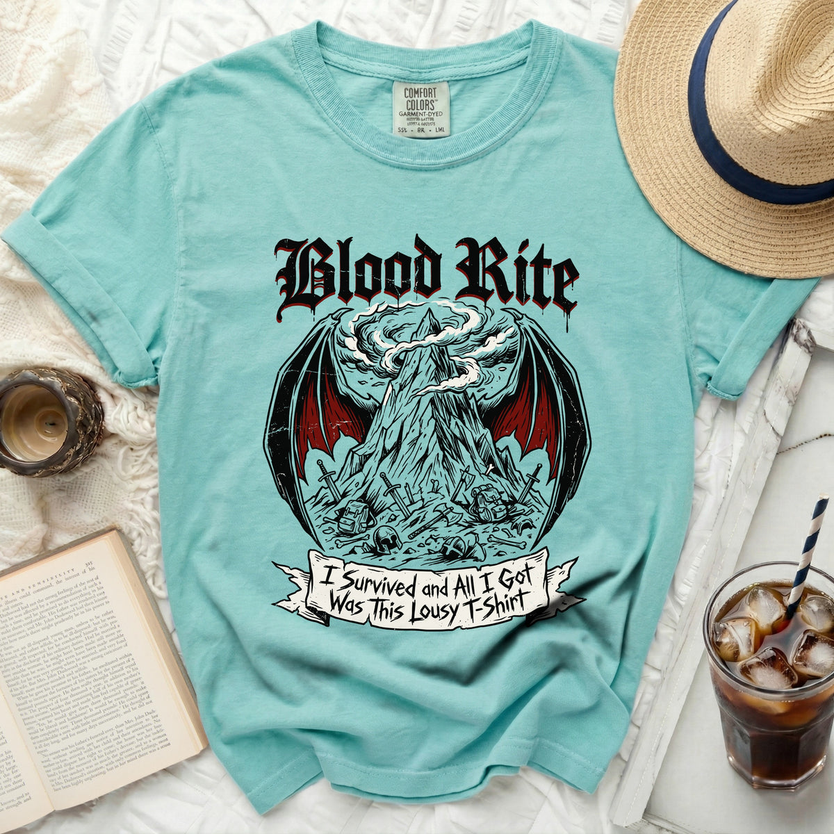 Teal t-shirt with "Blood Rite" and mountain graphic, I Survived and All I Got Was This Lousy T-Shirt.