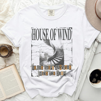 White t-shirt with "HOUSE OF WIND" and staircase graphic.