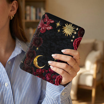 Black celestial design with gold sun, moon, stars, red flowers, and butterflies.