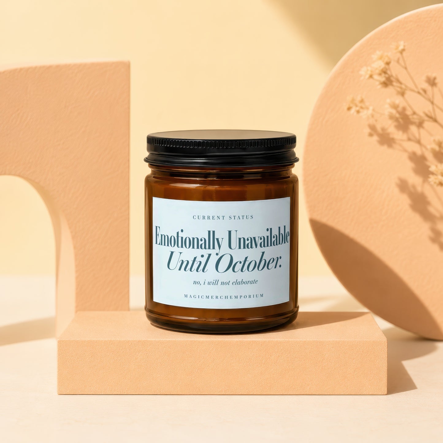 Amber jar candle with "Emotionally Unavailable Until October" text.