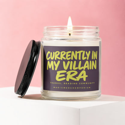 Lit candle in glass jar with lid off, reading "Currently in My Villain Era".