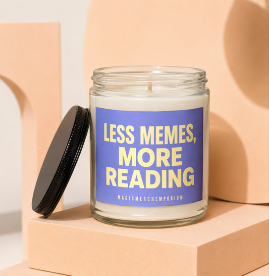 Glass candle with blue label reading "LESS MEMES, MORE READING"