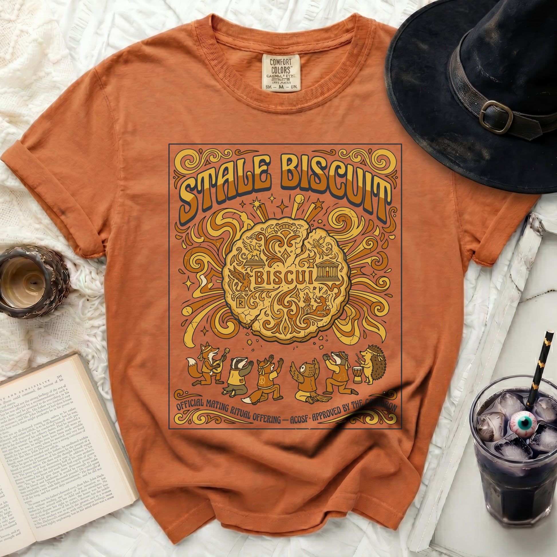 Orange t-shirt with "STALE BISCUIT" and woodland creatures design.