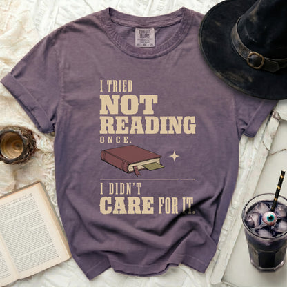Purple t-shirt with "I tried not reading once. I didn't care for it." text.
