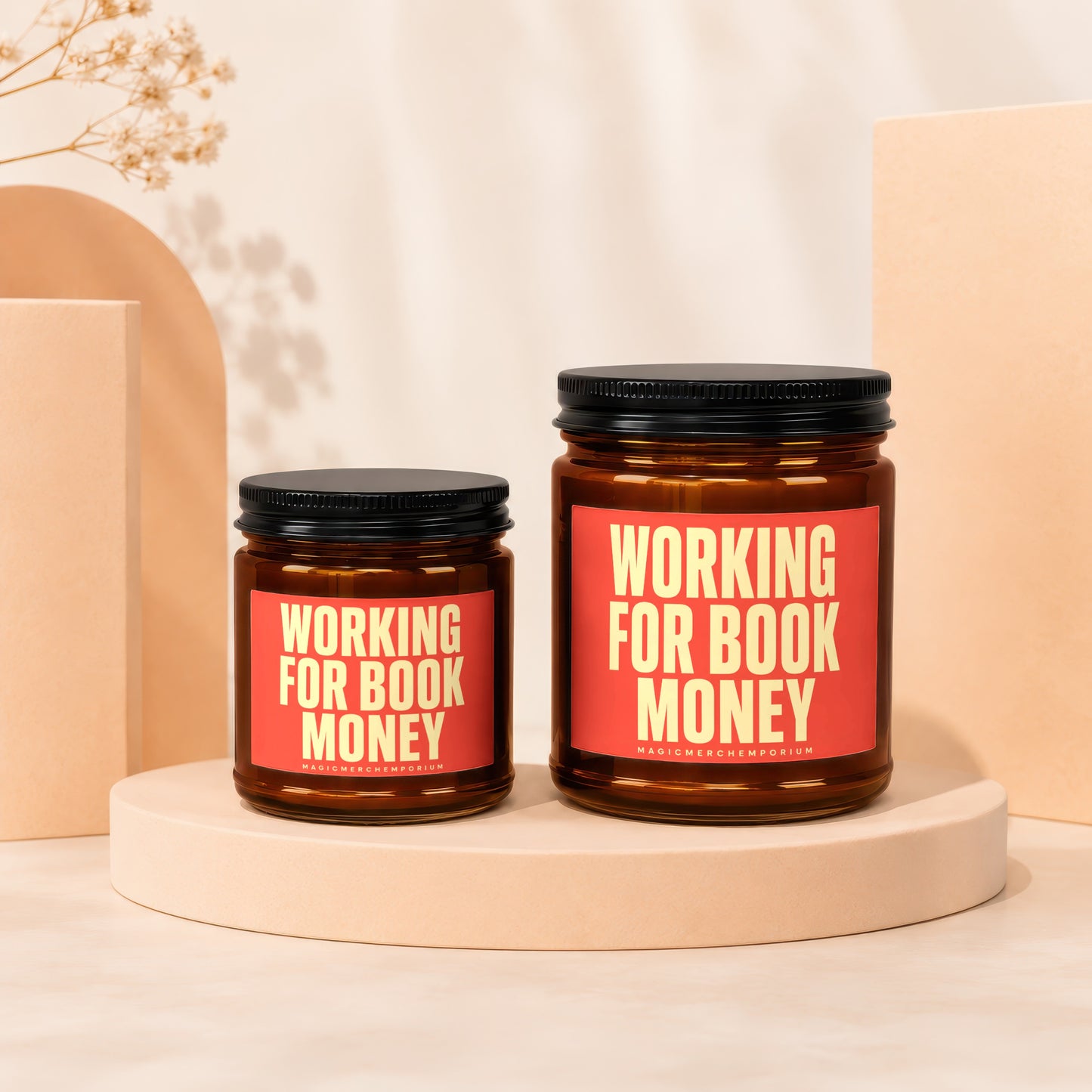 Two amber glass jars with black lids, labeled "WORKING FOR BOOK MONEY".