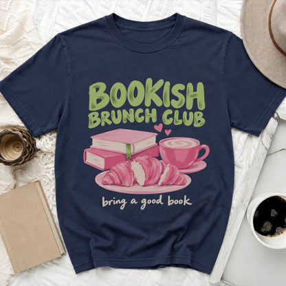 Navy t-shirt with "Bookish Brunch Club" text, books, croissants, and coffee.
