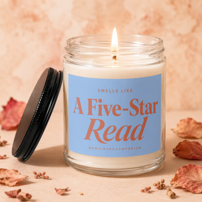 Lit candle in glass jar labeled "Smells Like A Five-Star Read".