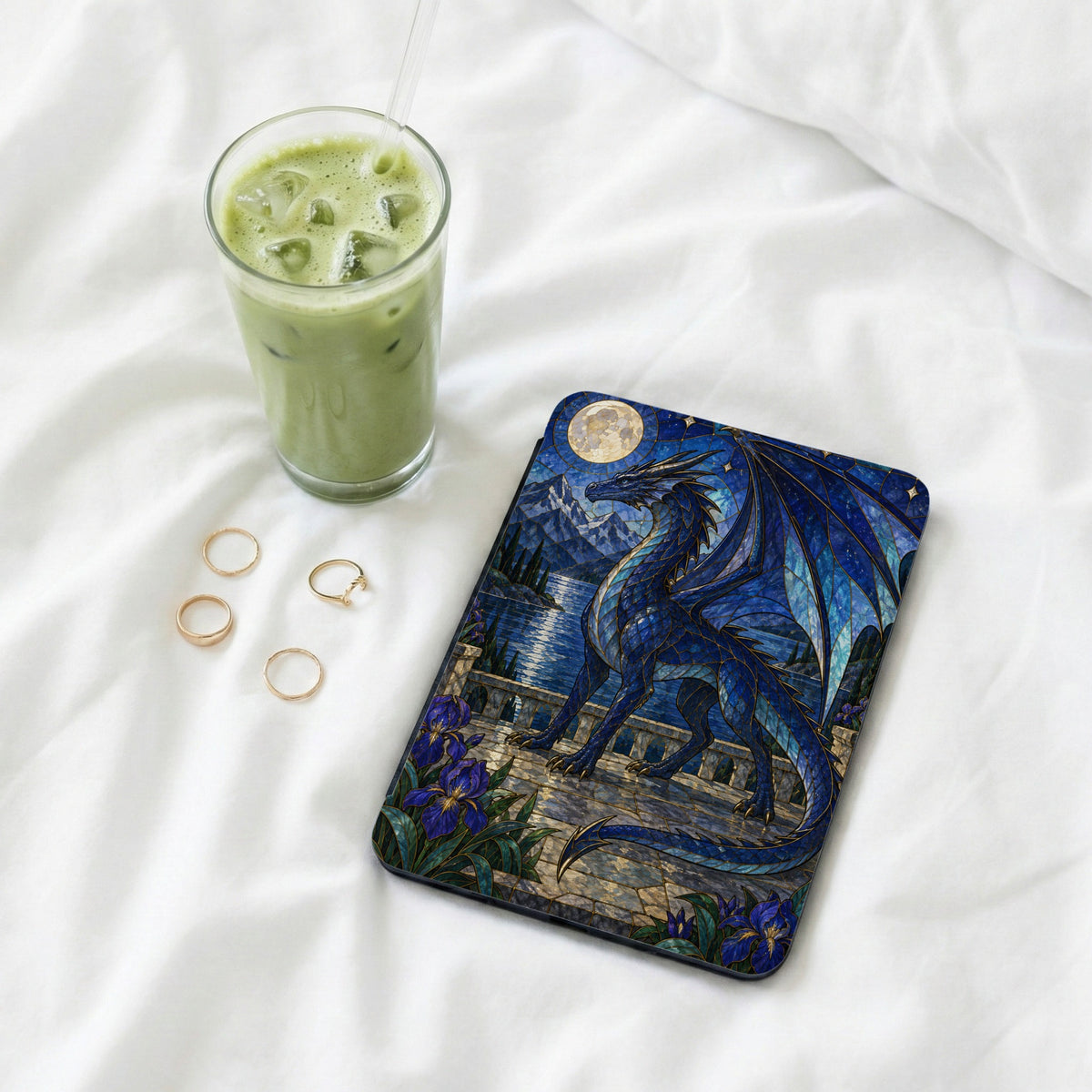 Tablet case with a blue dragon against a moonlit landscape with mountains and lake.
