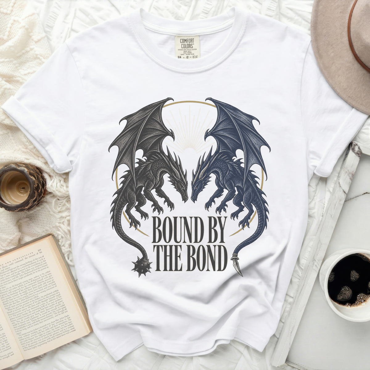White t-shirt with two dragons facing each other, text "BOUND BY THE BOND".