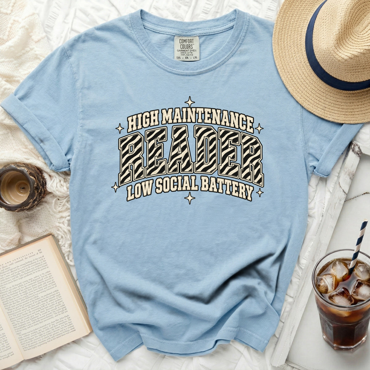 Light blue t-shirt with "High Maintenance Reader Low Social Battery" text.