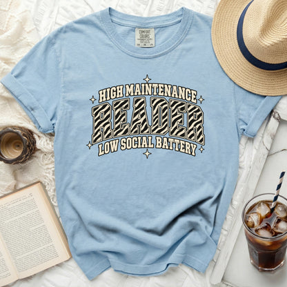 Light blue t-shirt with "High Maintenance Reader Low Social Battery" text.