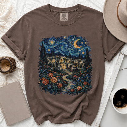 Brown t-shirt with a painting of a starry night over a villa and garden.