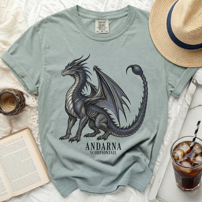 Light teal t-shirt with a black and blue dragon graphic and text "ANDARNA SCORPIONTAIL".
