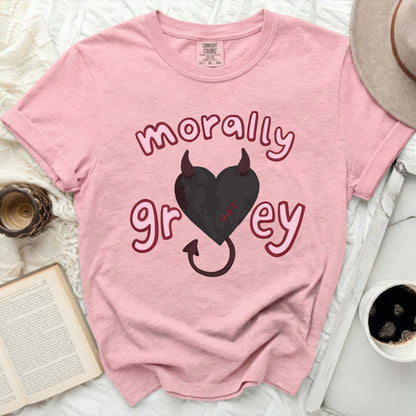 Pink t-shirt with "morally grey" text and a black heart with devil horns.