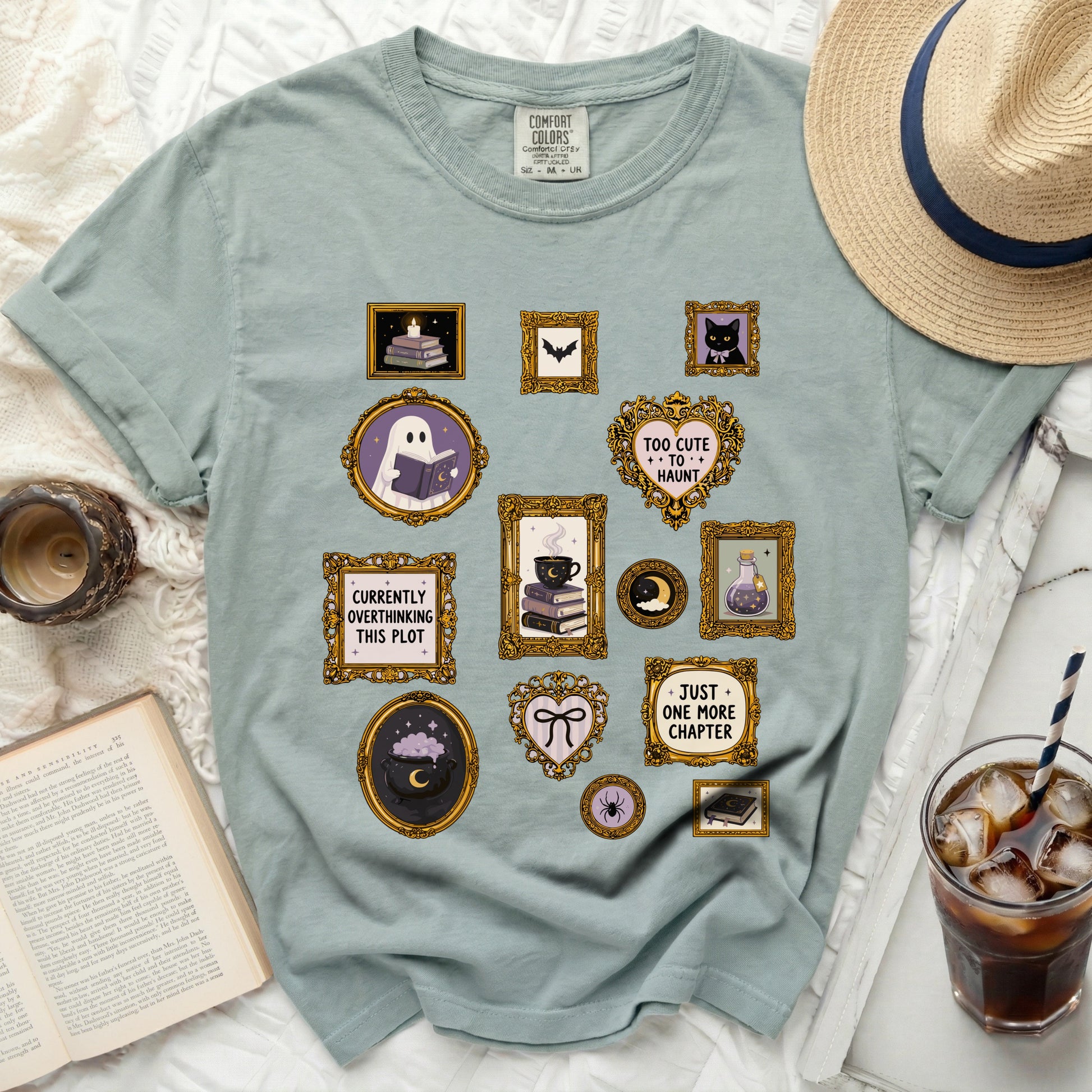 T-shirt with oval frames featuring ghost reading, books, candle, bat, cat, magic potion, and text.