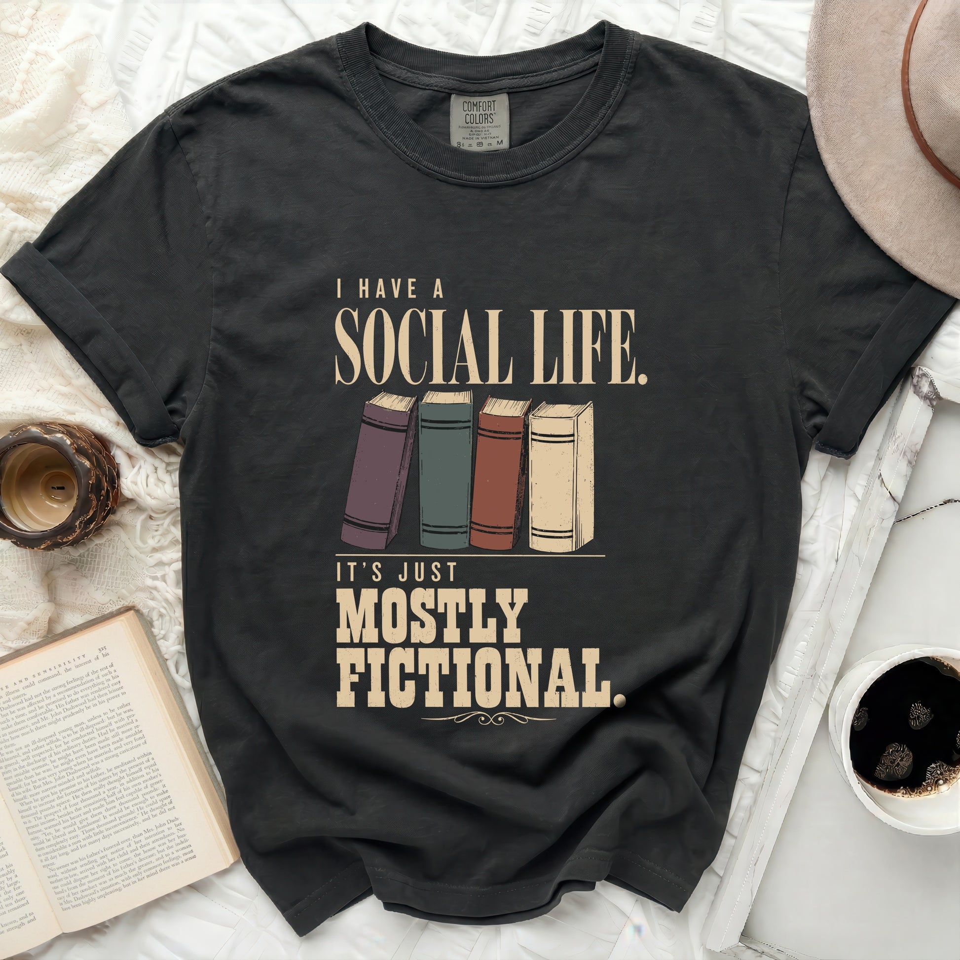 Dark t-shirt with "I Have a Social Life. It's Just Mostly Fictional." text.