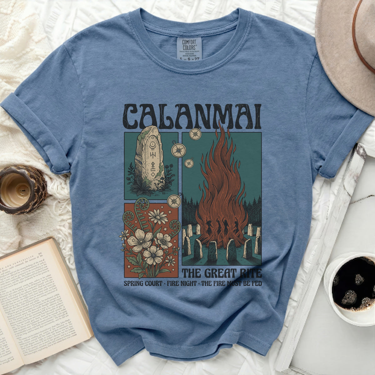 Calamai t-shirt with pagan symbols, bonfire, and flowers graphic.