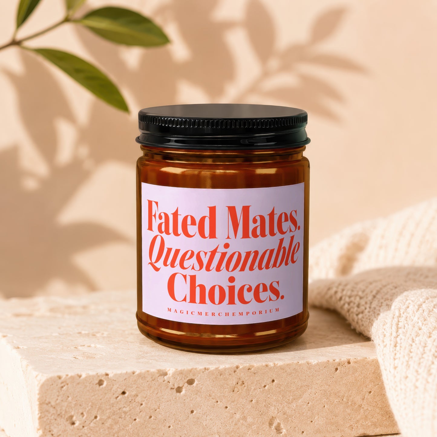 Amber jar candle with black lid, label reads "Fated Mates. Questionable Choices."