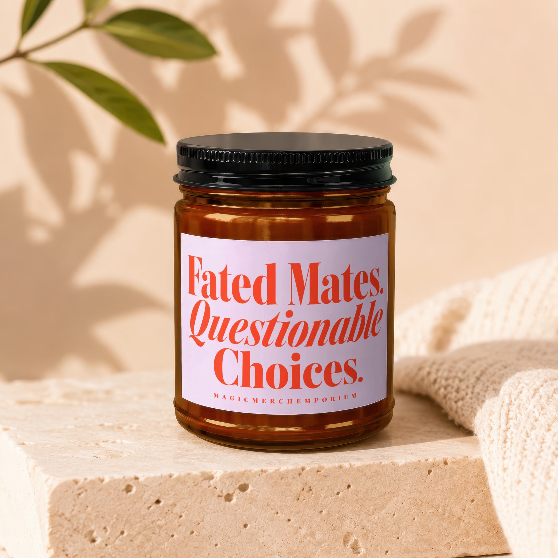 Amber jar candle with black lid, label reads "Fated Mates. Questionable Choices."