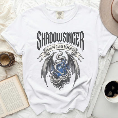 White t-shirt with "Shadowsinger" and "Shadow Daddy Defender" text and dragon graphic.