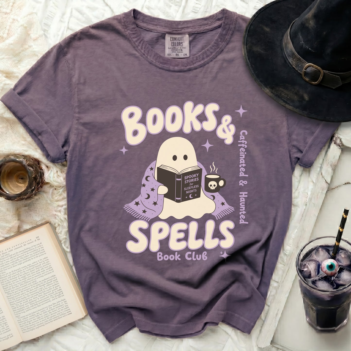 Purple t-shirt with a ghost reading "Books & Spells Book Club" graphic.