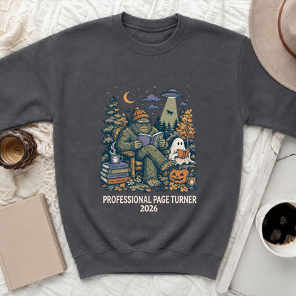 Dark gray sweatshirt with Bigfoot reading, a ghost, UFO, and pumpkins graphic with text.